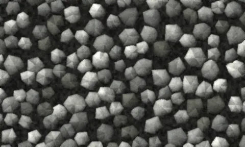 Angular grey crushed stone with open gaps between the pieces and no fine material.
