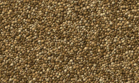 Fine golden-tan decomposed granite, mostly grit and dust with a few larger particles.