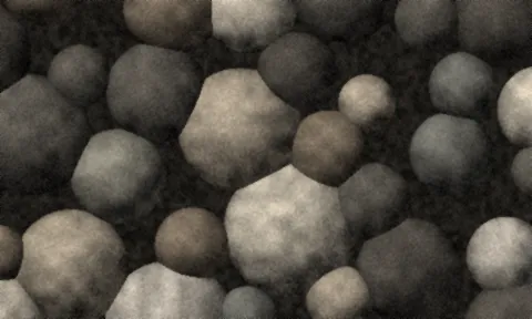Large smooth rounded river cobbles in grey, brown and cream.
